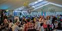 Attendees sitting in the marquee at Isle of Wight Literary Festival, what's on, event