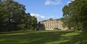 exterior of National Trust Nostell with trees, blue sky and grass