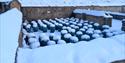 Pillars of an ancient hypocaust system at Chedworth Roman Villa in the snow