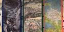 A photo pillar at the exhibition with fantasy maps