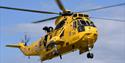 A yellow RAF Rescue helicopter in flight