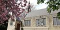 Newbold Parish Church with a blossom tree