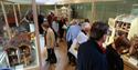 visitors looking at exhibition