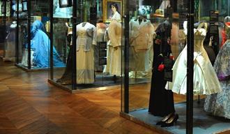 Image of a display of antiquated dresses.