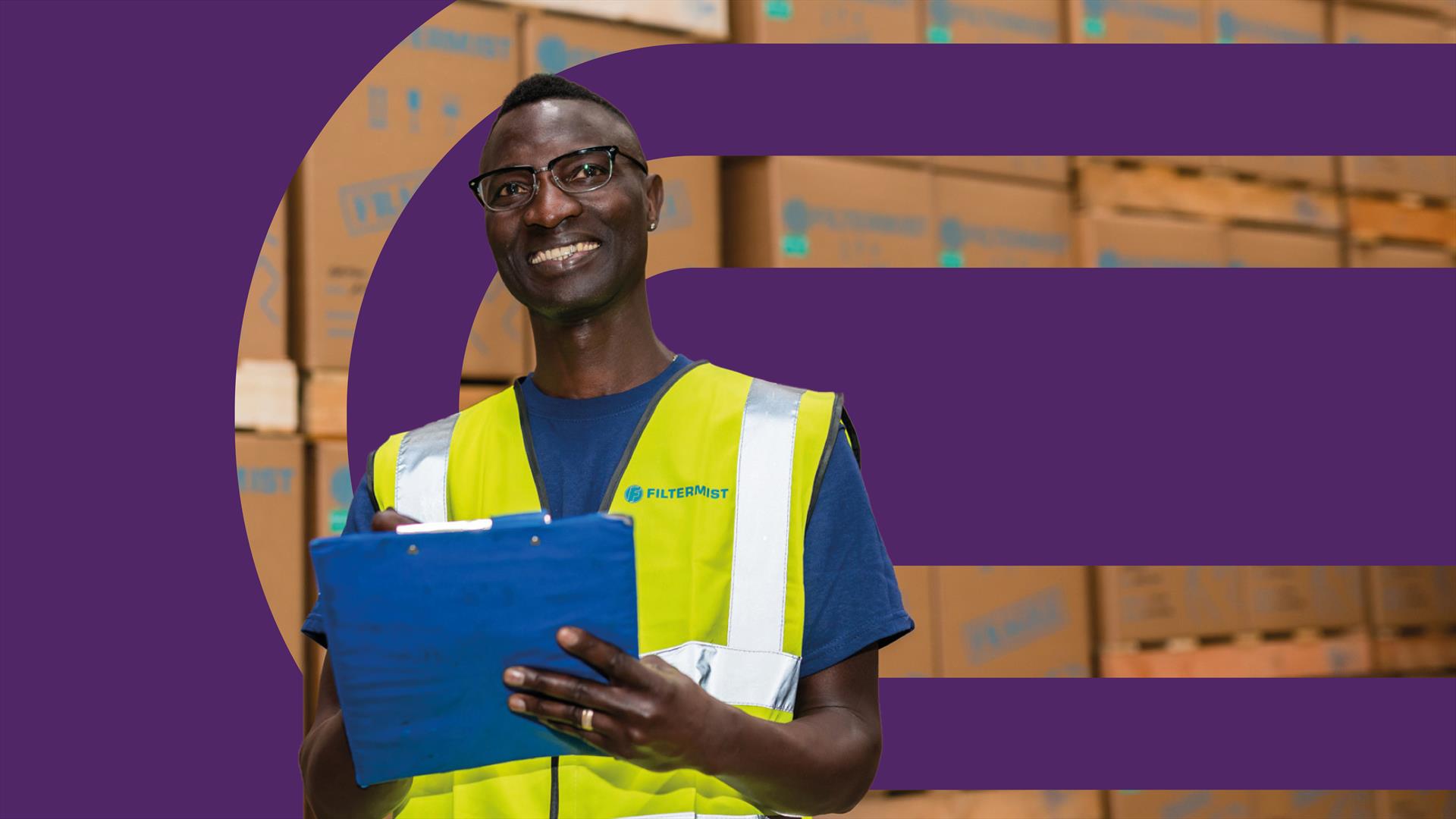 A man with a clipboard working in a logistics company in Telford