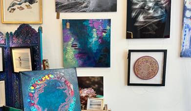 Inside Pink Seaweed gallery showcasing artwork by Vici Blackburn, Leanne Higgins, Greg Barlow and Mike Radcliffe, surrounded by handmade Manx treasure