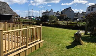 Outside view looking across the garden to the harbour