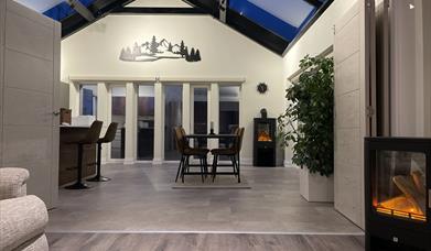 Tri-folding doors lead in to the large kitchen diner