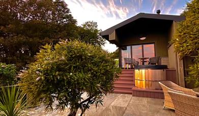 Front of property showing hot tub