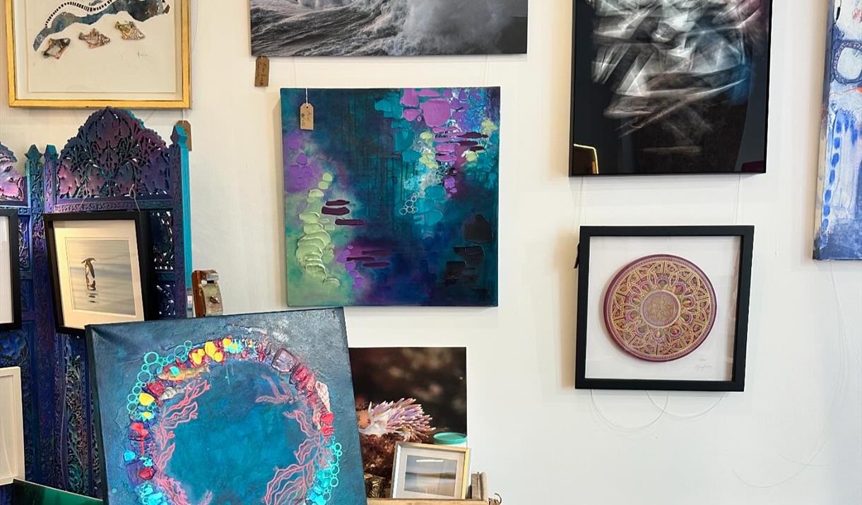 Inside Pink Seaweed gallery showcasing artwork by Vici Blackburn, Leanne Higgins, Greg Barlow and Mike Radcliffe, surrounded by handmade Manx treasure