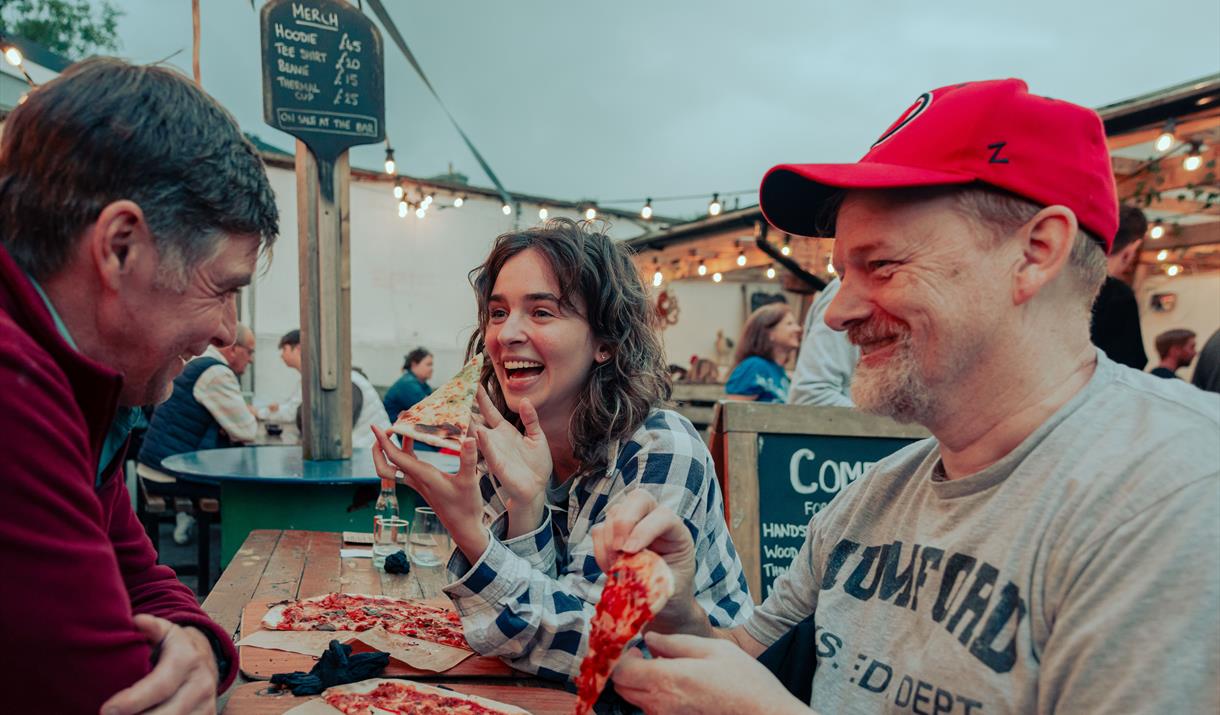 Friends enjoying pizza