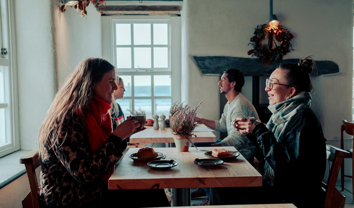 Friends having coffee and cake