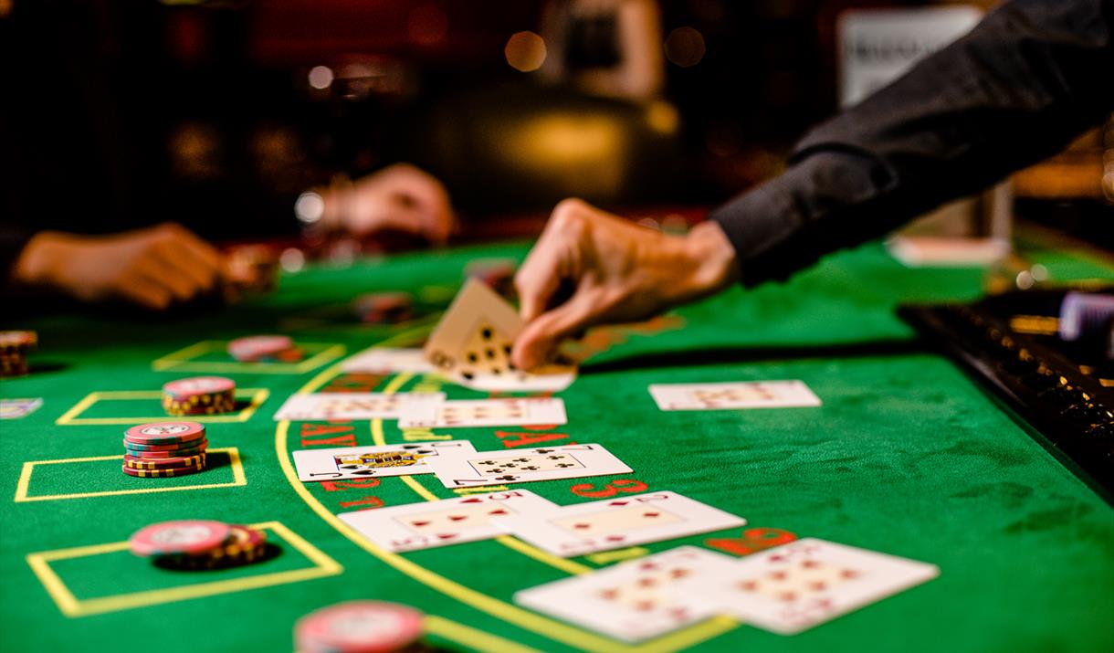 Graphics of a blackjack table with Australian landmarks in the background