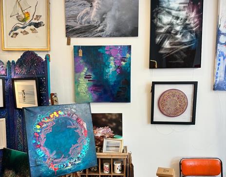 Inside Pink Seaweed gallery showcasing artwork by Vici Blackburn, Leanne Higgins, Greg Barlow and Mike Radcliffe, surrounded by handmade Manx treasure
