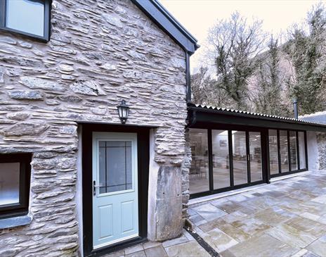 Entrance and bi fold doors to access outside courtyard.