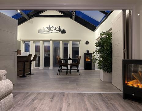 Tri-folding doors lead in to the large kitchen diner