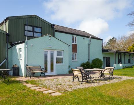 Ground floor terrace with garden overlooking the mountains and Douglas Bay.