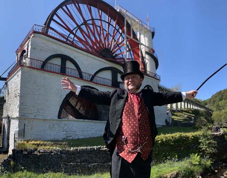 Mine Captain Rowe narrates a video greeting in the Welcome Centre, Christ Church, Laxey. Costume volunteers greet visitors in the Welcome Centre.