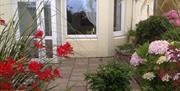 Chapel Bay Lodge entrance and patio garden