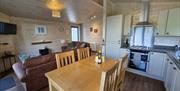 Single level property. Open plan living, dining and kitchen area with hard wood floors.