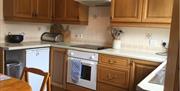 Kitchen with dining table well equipped