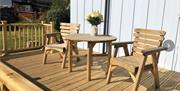 Outside view of deck with table and chairs