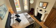 The spacious master bedroom with a super king bed and large wardrobe. Upon request, the bed can be converted into two singles.