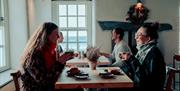 Friends having coffee and cake
