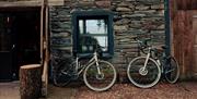 Bikes propped against exterior walls of The Coffee Cottage