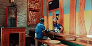 Cyclists having hot drinks at The Coffee Cottage