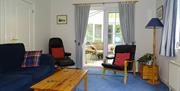 Living Room looking towards Conservatory and Garden