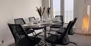 Isle of Man holiday apartment with 6-person dining table and a balcony commanding sea views