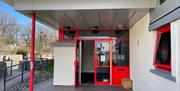 Red front entrance doors.