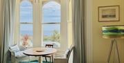 Sitting room looking out across Chapel Bay
