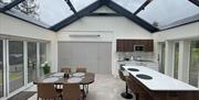 Showing the kitchen / diner closed off with tri folding doors.