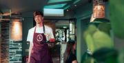 Waiter serving drinks