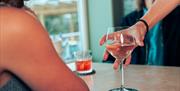 Glass of wine being served