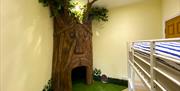Children's bedroom with bunk bed and magical tree