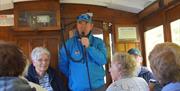 Blue-badge Guide Chris Callow commentating on the ride to the summit of Snaefell mountain aboard a vintage tram-car