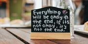 Motivational quote on blackboard