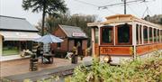 Tram arriving at cafe