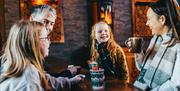 Family having festive hot drinks at The Coffee Cottage