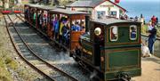 Sea Lion and busy train at Sea Lion Rocks Station