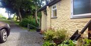 External shot of Cottage showing parking