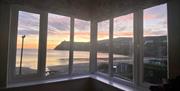 Enjoy the stunning sunsets from the upstairs lounge at Bay View Cottage overlooking Port Erin bay