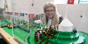 Speaker of the House of Keys inspecting the custom-built Lego model of Tynwald Day