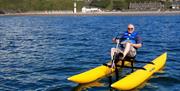 77 year old gentleman enjoying aquabiking in Port Erin