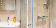 Our modern bathroom with walk-in shower is clean, bright and fresh.