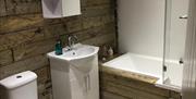 Chapel Bay Lodge bathroom with shower over bath