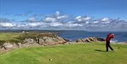 Golfing on one of the Island's coastal courses